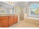 Spa-like bathroom featuring a shower, vanity, and large mirror at 3356 Renfro St, Marietta, GA 30066