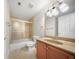 Bathroom with tub shower, vanity, and beige tile at 3356 Renfro St, Marietta, GA 30066
