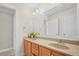 Double vanity bathroom with modern fixtures and large mirror at 3356 Renfro St, Marietta, GA 30066