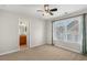 Bedroom with ceiling fan, adjacent bathroom access, and ample closet space at 3356 Renfro St, Marietta, GA 30066