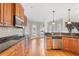 Eat-in kitchen with granite countertops, stainless steel appliances, and hardwood floors at 3356 Renfro St, Marietta, GA 30066