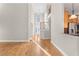 Open living room with hardwood floors and a view of the kitchen at 3356 Renfro St, Marietta, GA 30066
