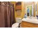 Clean bathroom with shower, vanity, and wood cabinets at 4450 Millenium View Ct, Snellville, GA 30039