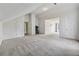 Large carpeted room with neutral paint, multiple closets, and access to an ensuite bathroom at 4450 Millenium View Ct, Snellville, GA 30039