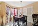 Bright breakfast nook with a table and chairs near a window at 4450 Millenium View Ct, Snellville, GA 30039