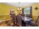 Dining room features a large table, seating for eight, and an open view to the living area at 4450 Millenium View Ct, Snellville, GA 30039