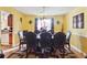 Dining room featuring a wood table, leather chairs, and a sunlit space at 4450 Millenium View Ct, Snellville, GA 30039