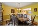 Elegant dining room with a large table, seating for eight, and stylish decor at 4450 Millenium View Ct, Snellville, GA 30039