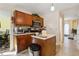 Kitchen boasts wood cabinets, an island, and stainless steel appliances at 4450 Millenium View Ct, Snellville, GA 30039