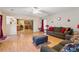 Bright and airy living room with hardwood floors, a cozy seating area, and an open view to the kitchen at 4450 Millenium View Ct, Snellville, GA 30039