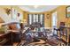 Living room featuring leather sofas, a coffee table, and warm-toned walls at 4450 Millenium View Ct, Snellville, GA 30039