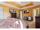 Main bedroom with large bed, dresser and TV at 4450 Millenium View Ct, Snellville, GA 30039