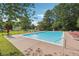 Inviting community pool area with lounge chairs and umbrellas for sunny relaxation days at 4450 Millenium View Ct, Snellville, GA 30039
