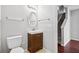 Clean bathroom with a vanity, toilet and access to stairs at 5480 Sable Bay Pt, Atlanta, GA 30349