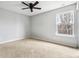 Bright bedroom featuring a large window and ceiling fan at 5480 Sable Bay Pt, Atlanta, GA 30349