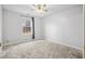 Bright bedroom with carpet flooring and a window with natural light at 5480 Sable Bay Pt, Atlanta, GA 30349