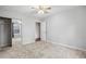 Spacious bedroom with carpet flooring and mirrored closet doors at 5480 Sable Bay Pt, Atlanta, GA 30349