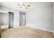 Spacious bedroom with mirrored closet and ceiling fan at 5480 Sable Bay Pt, Atlanta, GA 30349
