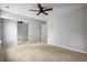 Spacious bedroom with ceiling fan and mirrored closet doors at 5480 Sable Bay Pt, Atlanta, GA 30349