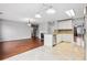 Open concept kitchen with a breakfast bar and tile floors at 5480 Sable Bay Pt, Atlanta, GA 30349