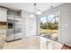 Eat-in kitchen with sliding glass doors leading to the backyard at 5480 Sable Bay Pt, Atlanta, GA 30349