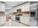 Updated kitchen featuring white cabinets and stainless steel appliances at 5480 Sable Bay Pt, Atlanta, GA 30349