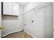 Laundry room with overhead cabinets and wire shelving at 5480 Sable Bay Pt, Atlanta, GA 30349