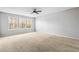 Main bedroom with carpet flooring and large windows at 5480 Sable Bay Pt, Atlanta, GA 30349