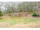 Playset in spacious backyard with trees at 1400 New Hope Church Rd, Loganville, GA 30052