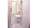 Clean bathroom with shower, toilet, and pedestal sink at 1400 New Hope Church Rd, Loganville, GA 30052
