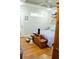 Main bedroom with hardwood floors, a wooden storage chest, and a ceiling fan at 1400 New Hope Church Rd, Loganville, GA 30052