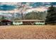 Ranch house with carport and expansive yard at 1400 New Hope Church Rd, Loganville, GA 30052