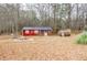 Red guest house with wooden porch at 1400 New Hope Church Rd, Loganville, GA 30052