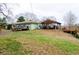 Back of house, deck, and covered patio at 1400 New Hope Church Rd, Loganville, GA 30052