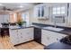 Well-equipped kitchen featuring white cabinets and an island at 1400 New Hope Church Rd, Loganville, GA 30052