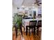 Spacious kitchen featuring an island, white cabinetry, and hardwood floors at 1400 New Hope Church Rd, Loganville, GA 30052