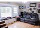 Relaxing living room with a large window, comfy seating, and hardwood floors at 1400 New Hope Church Rd, Loganville, GA 30052