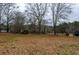Open grassy yard with wooden fence at 1400 New Hope Church Rd, Loganville, GA 30052