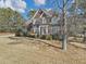 Two-story brick house with mature trees and grassy yard at 101 Lumby Ln, Stockbridge, GA 30281