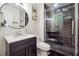 Modern bathroom with a walk in shower and dark tile at 2082 Perkerson Sw Rd, Atlanta, GA 30310