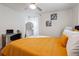 Bedroom with a queen bed, mustard yellow comforter and gold accents at 2082 Perkerson Sw Rd, Atlanta, GA 30310