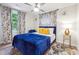 Bright bedroom with a queen bed and yellow pillows at 2082 Perkerson Sw Rd, Atlanta, GA 30310