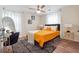 Bedroom with a queen bed, mustard yellow comforter and gold accents at 2082 Perkerson Sw Rd, Atlanta, GA 30310