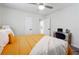 Bedroom with a queen bed, mustard yellow comforter and gold accents at 2082 Perkerson Sw Rd, Atlanta, GA 30310