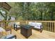 Spacious deck with seating area and fire pit table at 2082 Perkerson Sw Rd, Atlanta, GA 30310