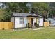 Updated bungalow with a fenced yard and modern exterior at 2082 Perkerson Sw Rd, Atlanta, GA 30310