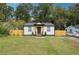 Cute bungalow with a freshly painted exterior and landscaped lawn at 2082 Perkerson Sw Rd, Atlanta, GA 30310
