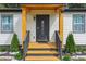Modern front door with sidelights and a welcoming porch at 2082 Perkerson Sw Rd, Atlanta, GA 30310