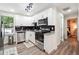 Modern kitchen with white cabinets, stainless steel appliances, and granite countertops at 2082 Perkerson Sw Rd, Atlanta, GA 30310