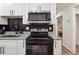 Stylish kitchen boasts stainless steel appliances and granite countertops at 2082 Perkerson Sw Rd, Atlanta, GA 30310
